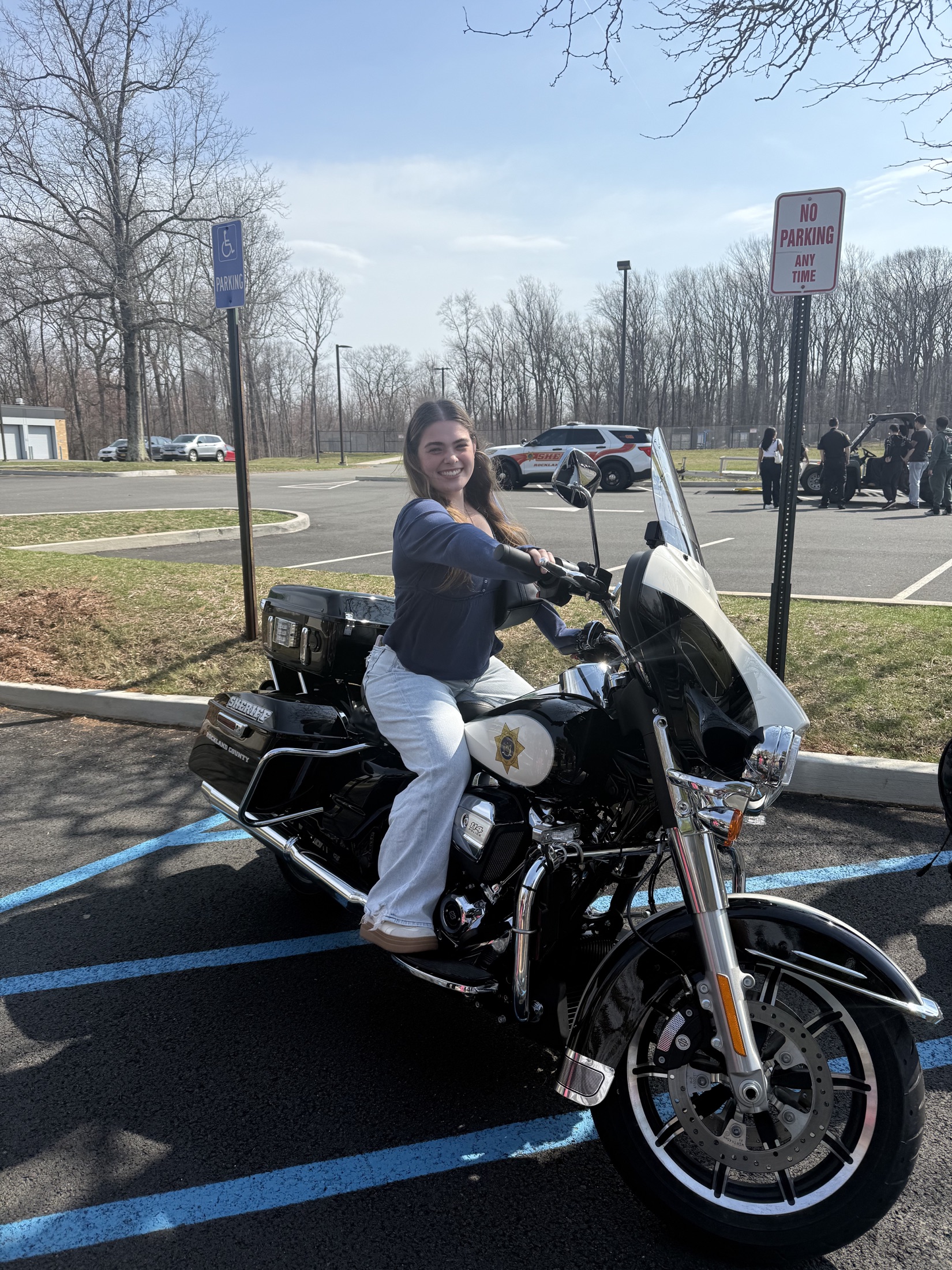 Student learning about sheriff motorcycle equipment