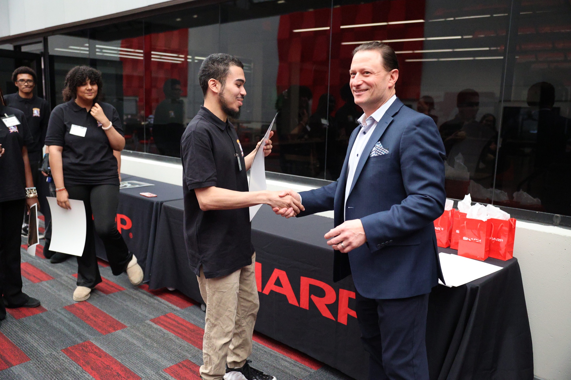 Student being recognized for Save 653 creative work